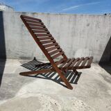 Teak lounge chair with foldable slats