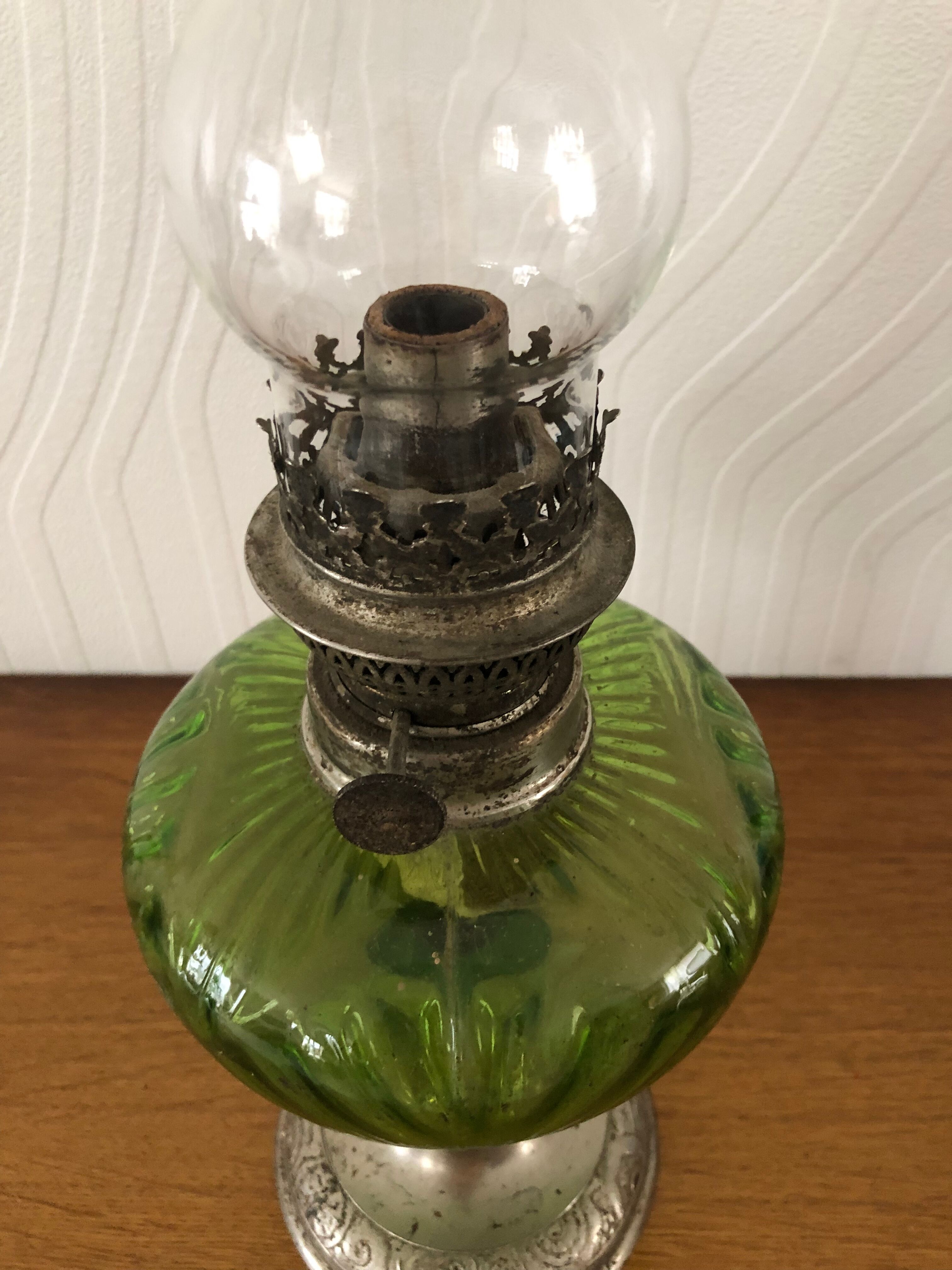 Antique oil lamp in glass and metal