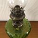 Antique oil lamp in glass and metal