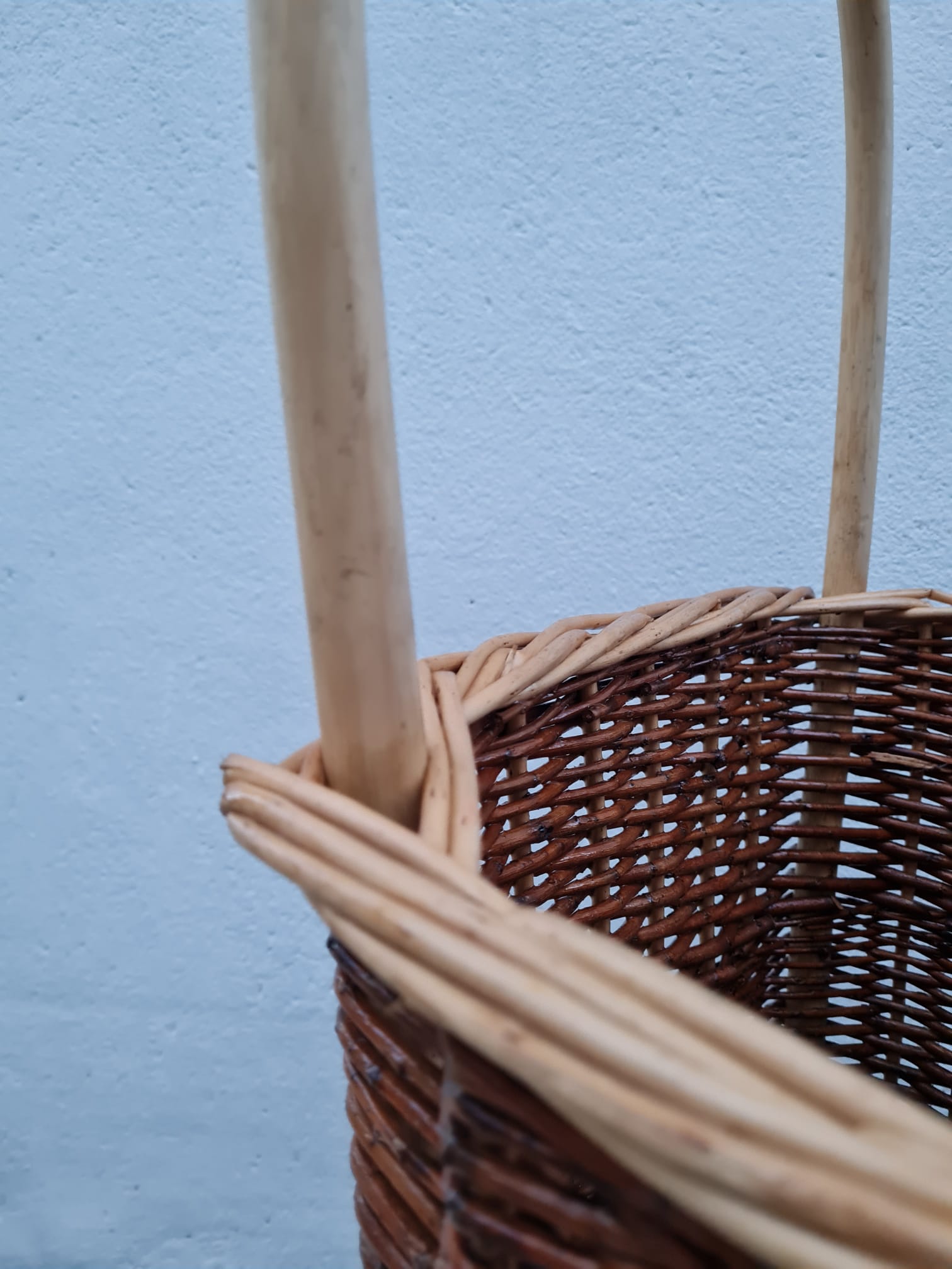 Vintage wicker log basket on vintage wheels