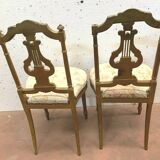 Paire de chaises de style Louis XVI en bois doré XX siècle