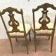 Paire de chaises de style Louis XVI en bois doré XX siècle