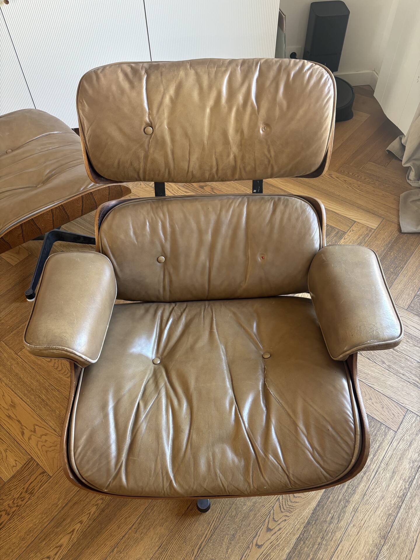 Armchairs and footrests by Charles & Ray Eames