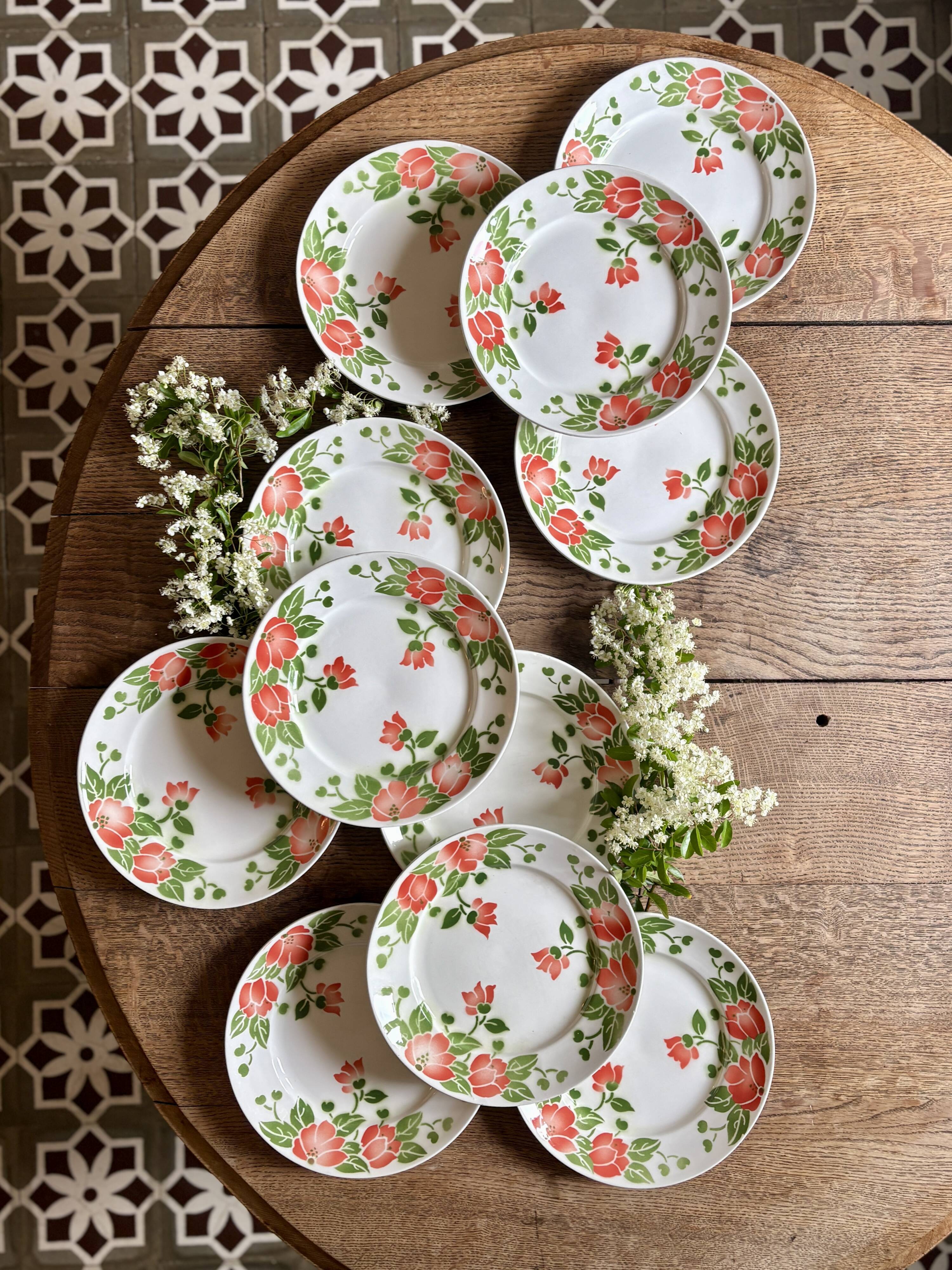 Set of 11 vintage flat plates by Eric de Moulin des Loups.