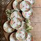 Set of 11 vintage flat plates by Eric de Moulin des Loups.