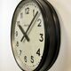 Black swiss industrial wall clock from inducta, 1960s