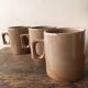 Lot of three cups or mugs stoneware of great fire of Brenne, France