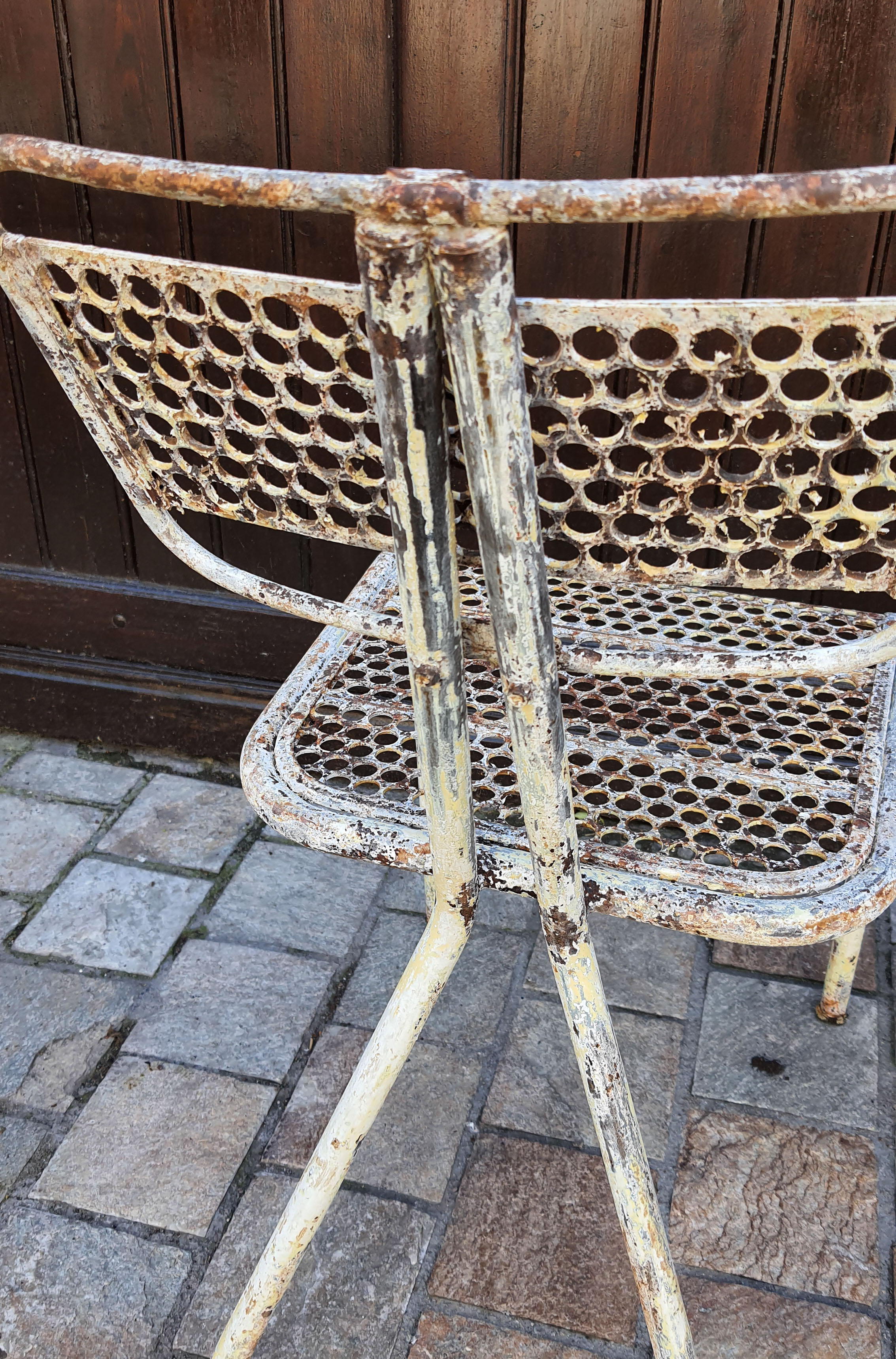 Perforated metal chairs René Malaval 1950