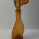 Amber glass bottle representing a dog, Empoli Italy 60s