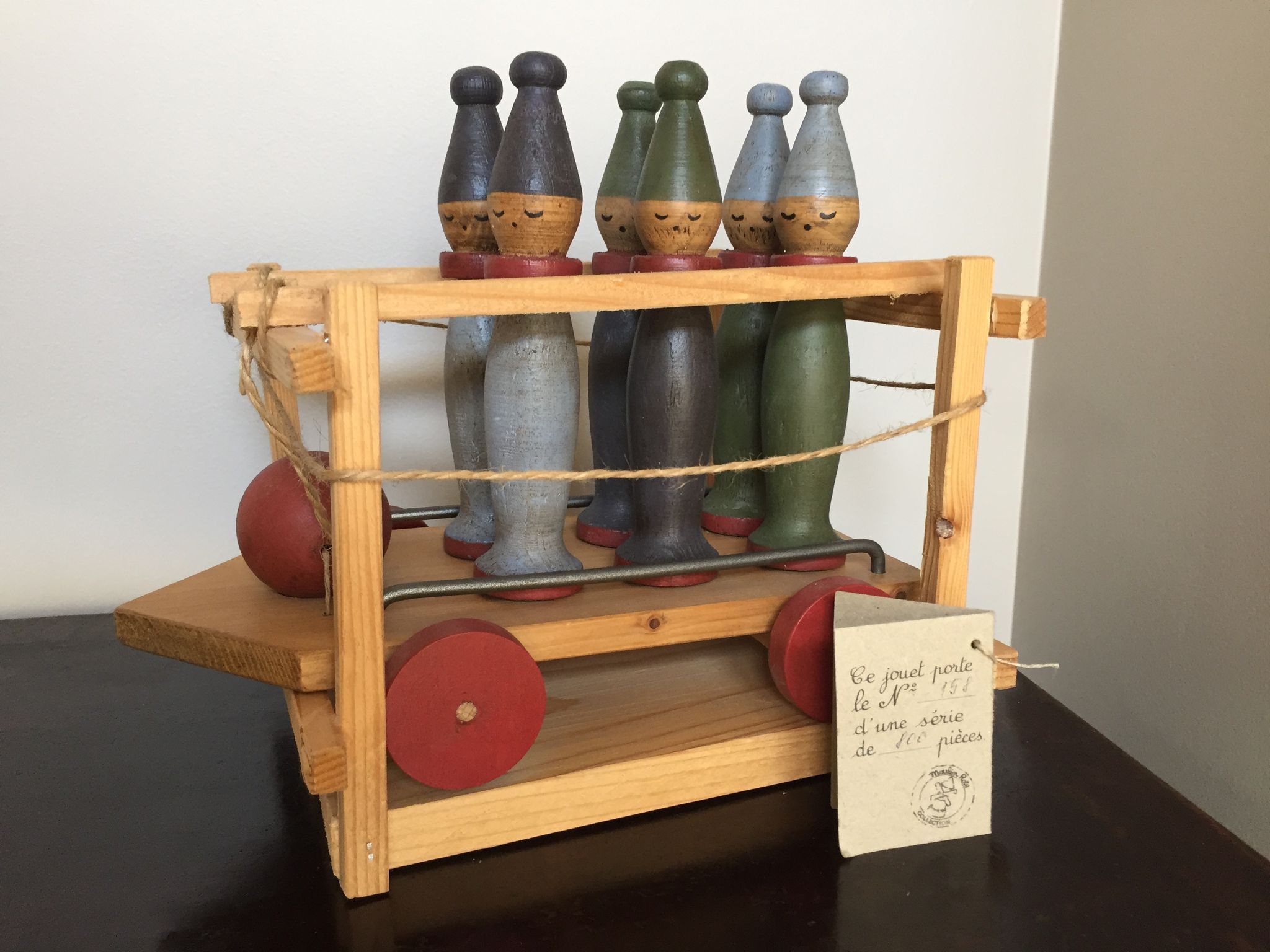 Set of Moulin Roty brand wooden bowling on roller cart, limited series.