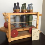 Set of Moulin Roty brand wooden bowling on roller cart, limited series.