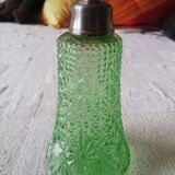 Small green bottle and old metal, single-flower vase