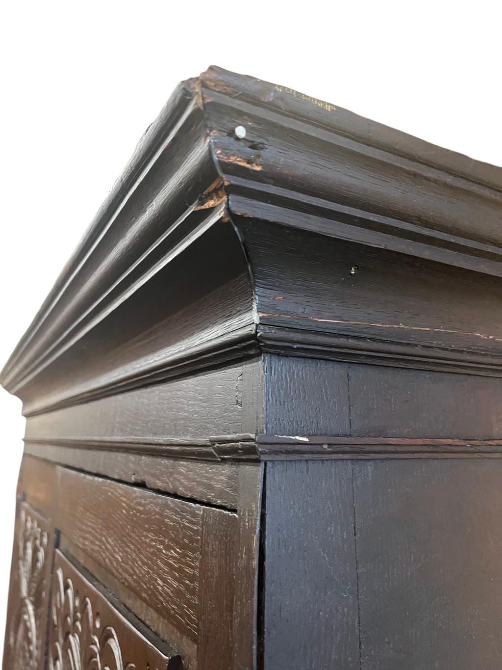 Antique tall wardrobe in dark carved wood / bohemian wardrobe