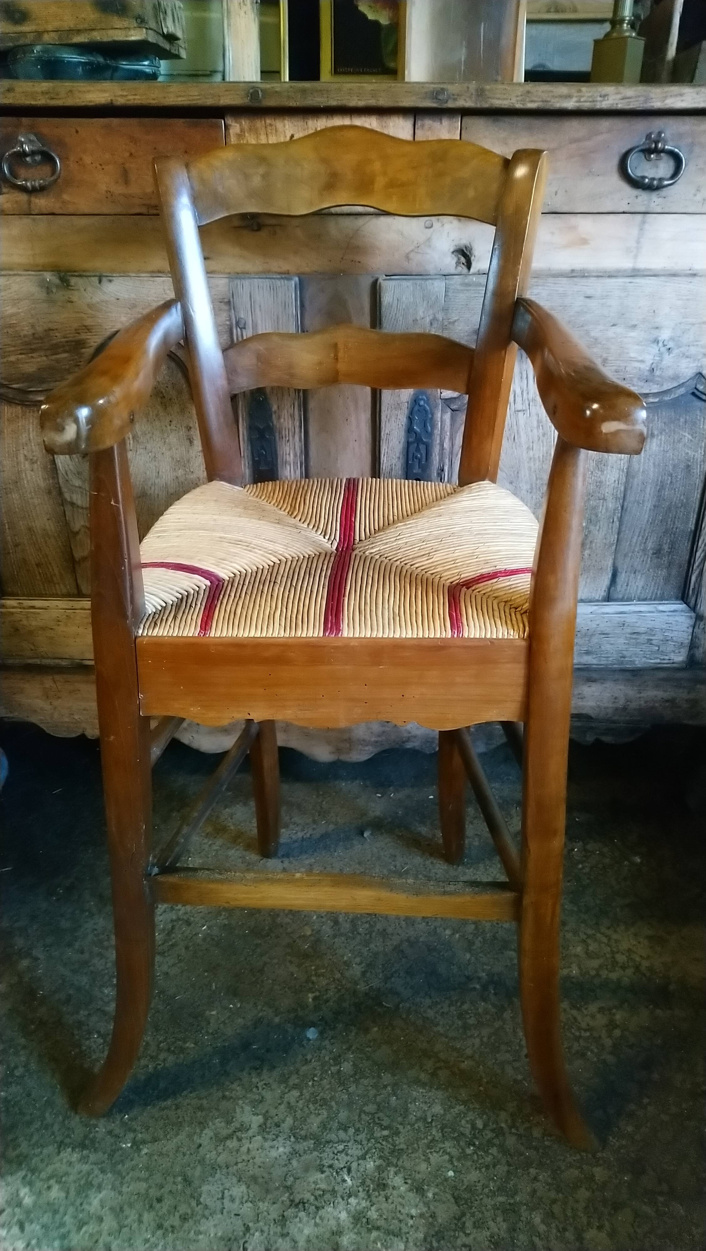 Child's high chair with a rush seat in walnut