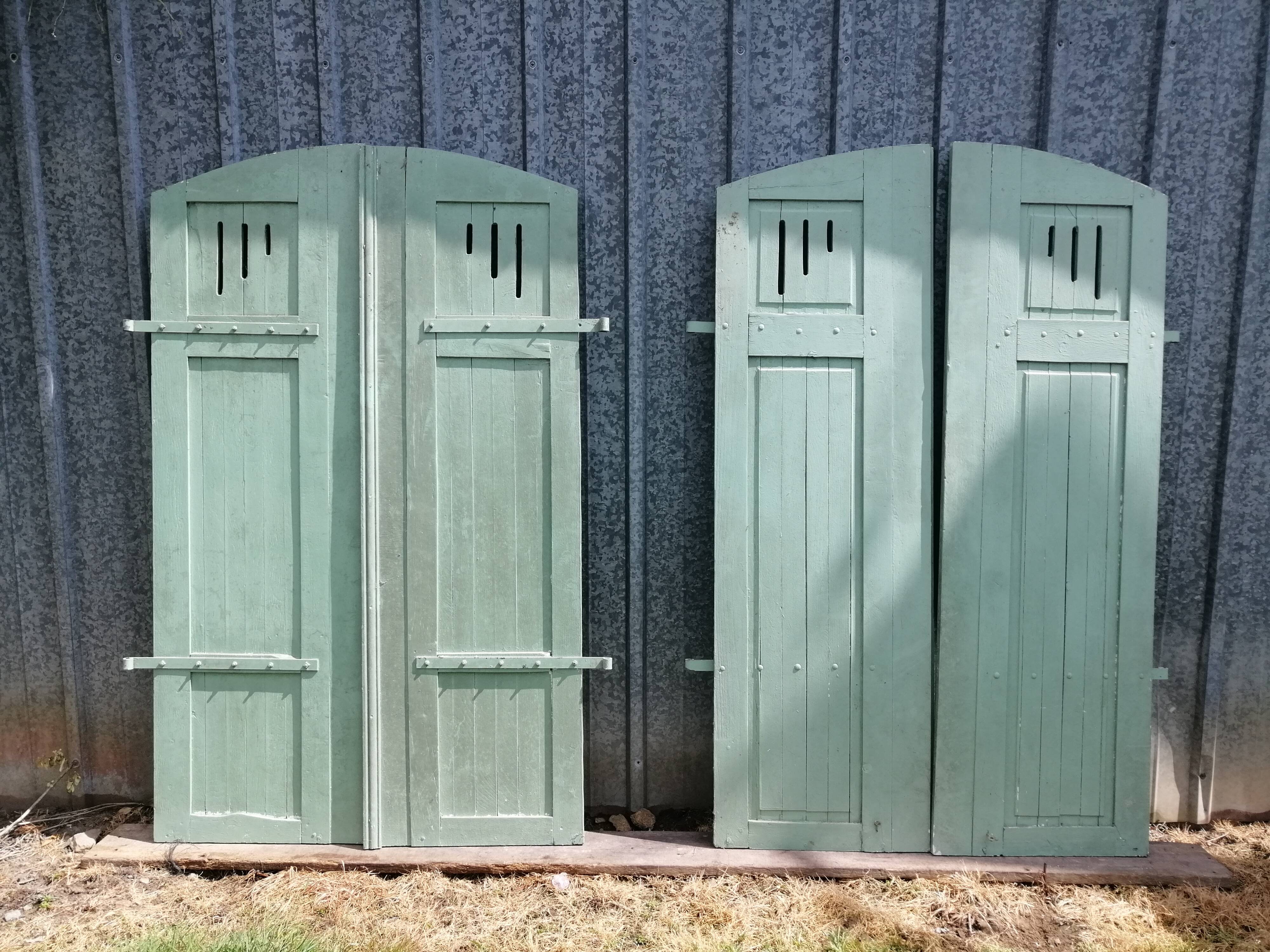Pairs of old painted oak shutters
