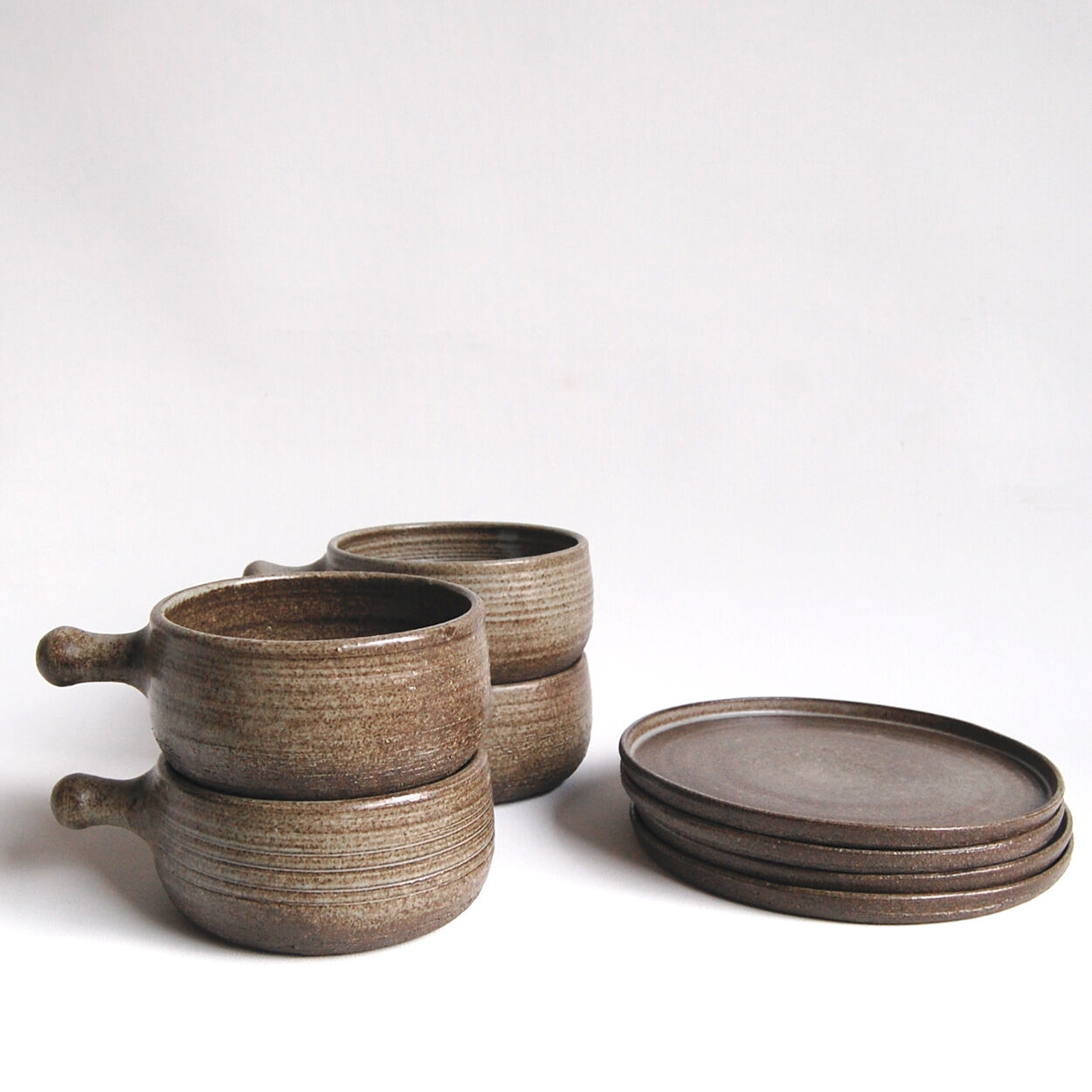 Set of 4 bowls and 4 plates by Thèrèse Bataille for the workshop of Dour 1970s
