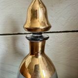 Glass and gilded bottle