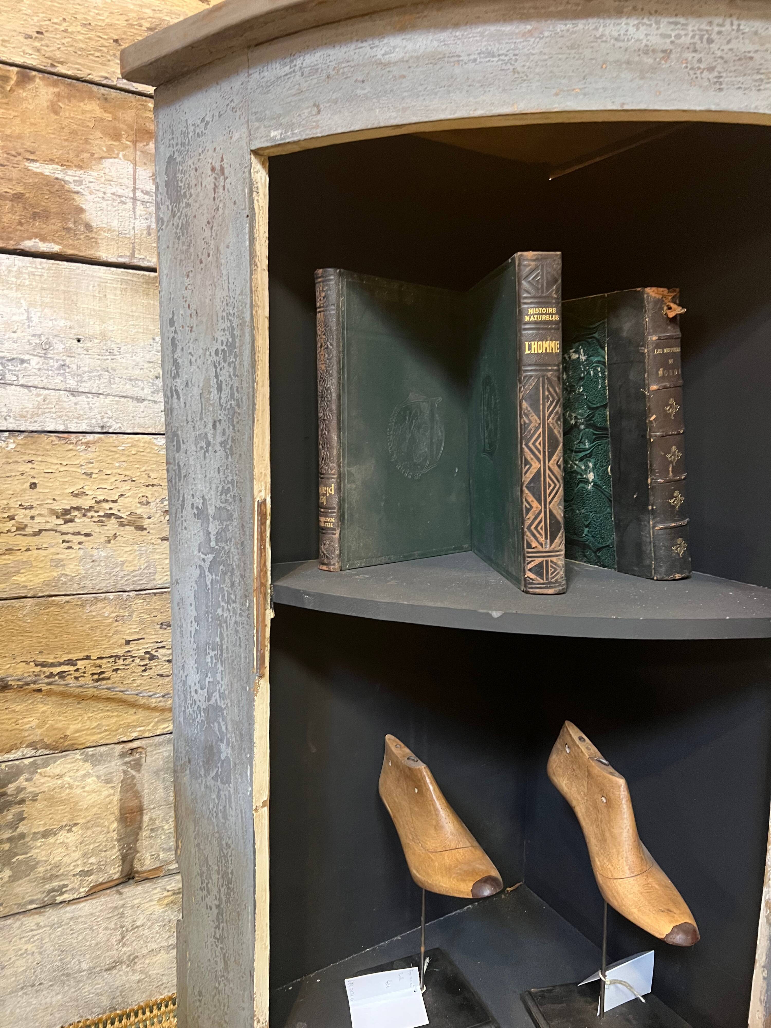 Eighteenth-century corner cabinet with a patina.