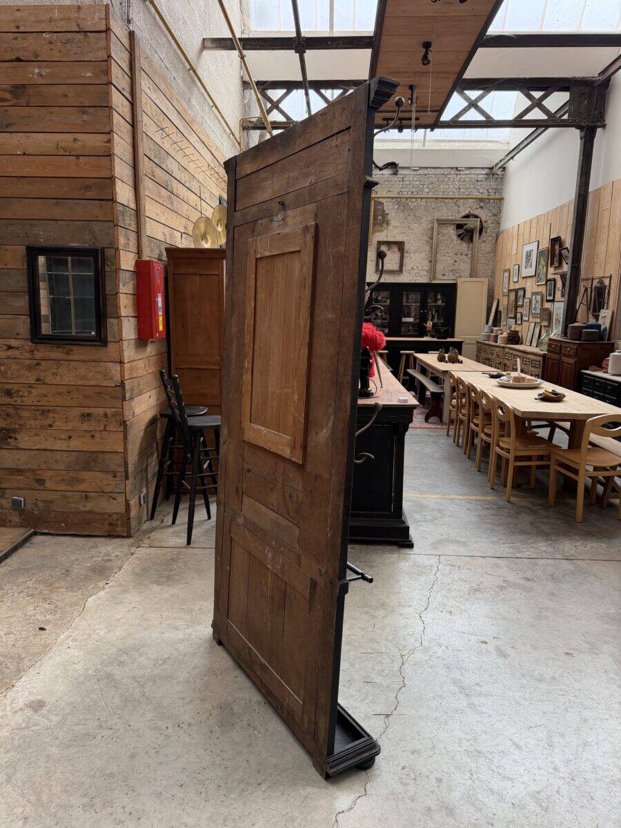 Patinated oak wardrobe from the early 20th century.