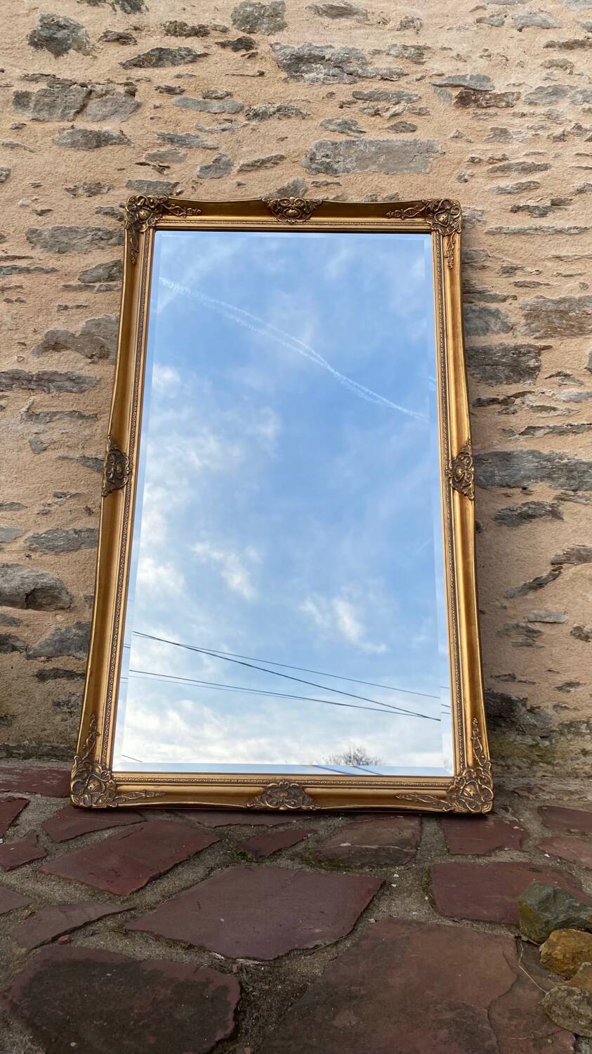 Large gilded carved wooden mirror