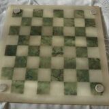 Onyx chessboard and complete wooden chess set.