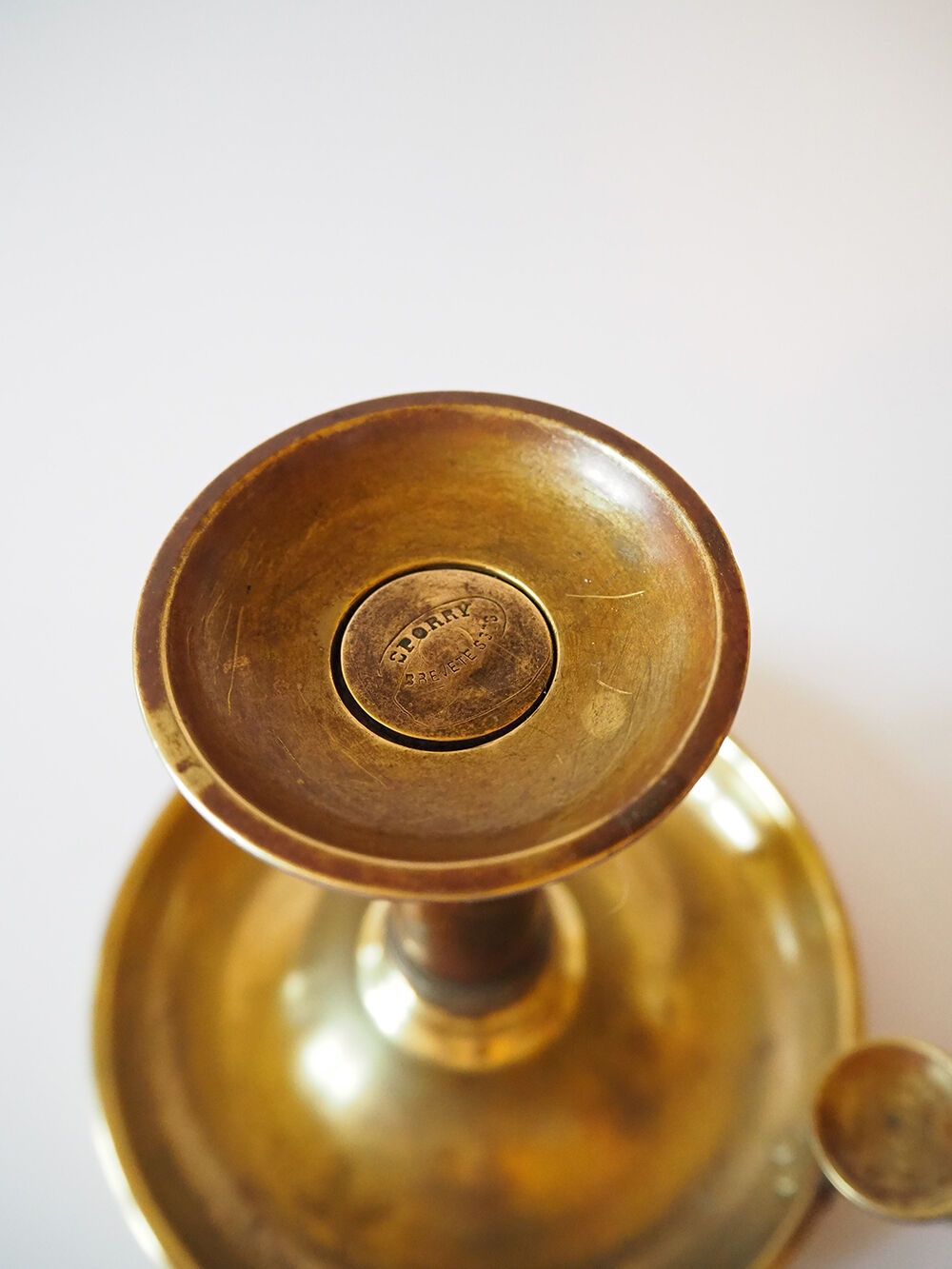 Set of three old brass candle holders