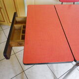 Table in red formica, 4 roc chairs, 2 extension cords, 2 drawers 60