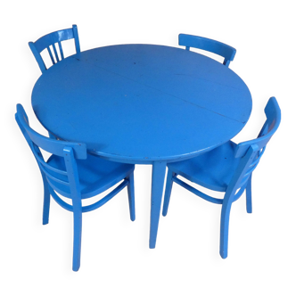 table ronde avec 4 chaises et 2 rallonges