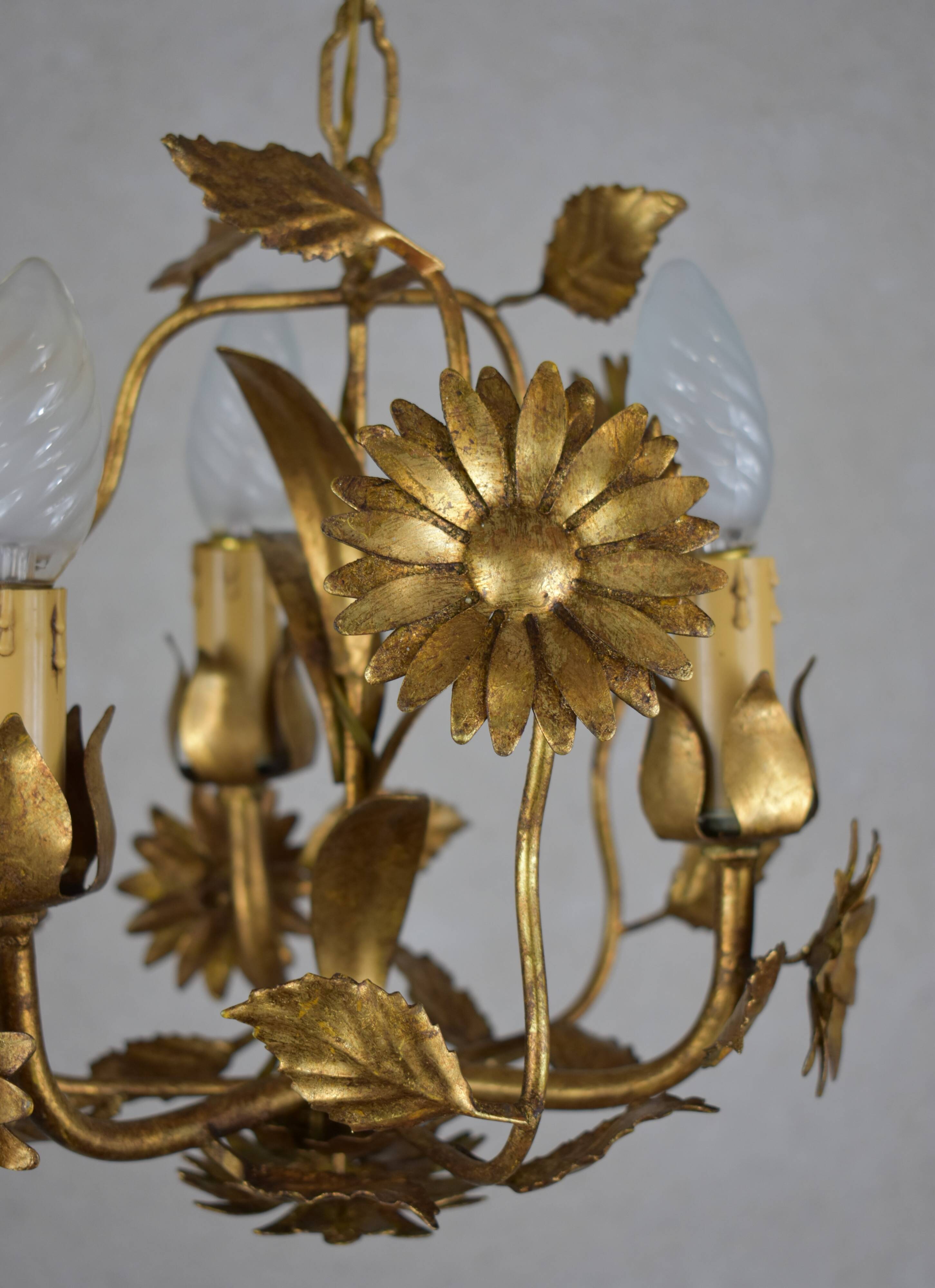 golden chandeliers with flowers.
