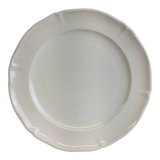 Old dish of ivory color and round shape with a chantourné edge.