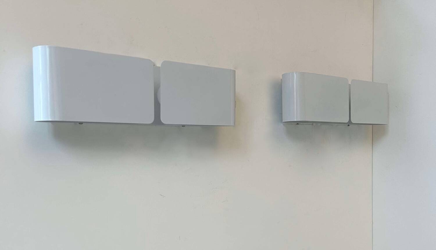 Pair of vintage wall lights, curved white metal, France 1980