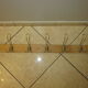 old coat rack with 5 metal hooks
