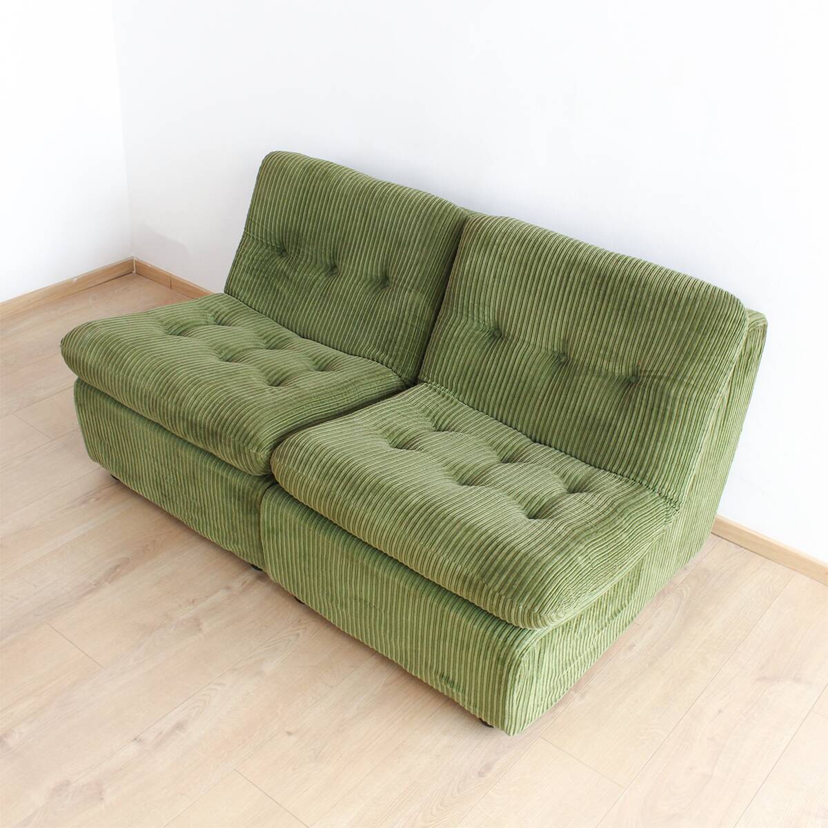 Modular vintage sofa with green cord upholstery