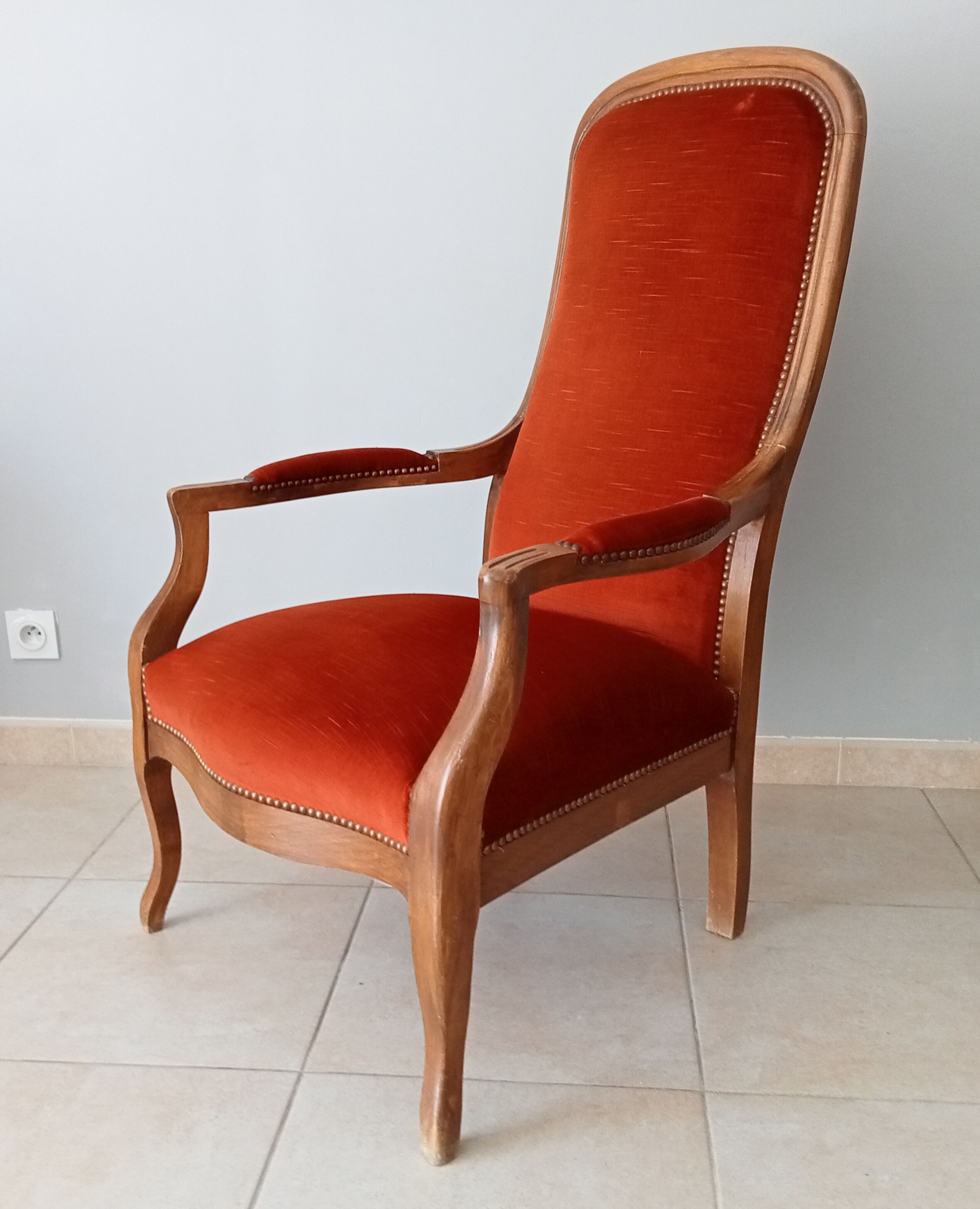 Walnut and velvet voltaire armchair