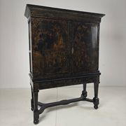 A rare early 18th-century Dutch japanned chinoiserie cabinet, circa 1700