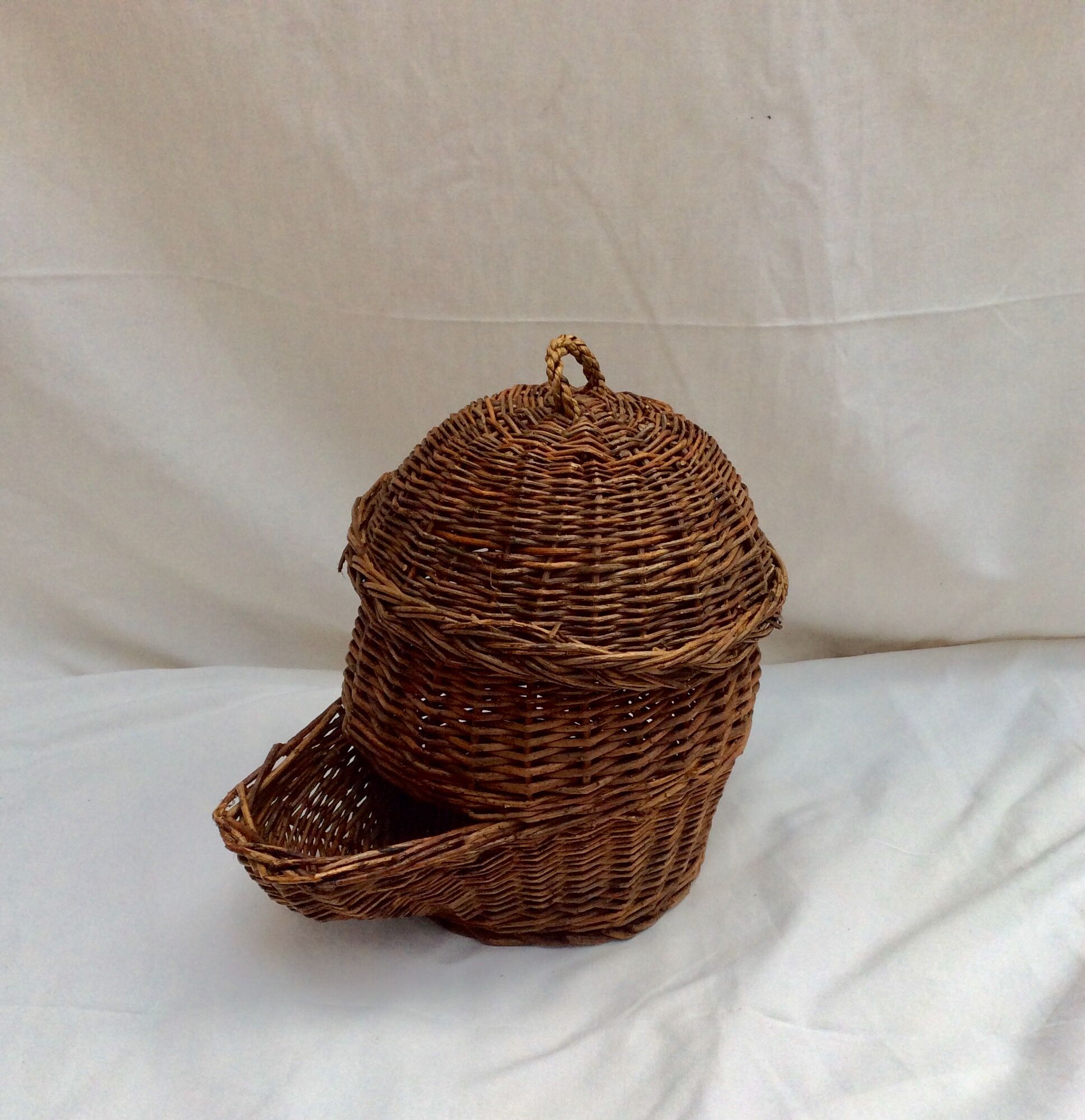 Wicker and rattan basket dispenser with lid