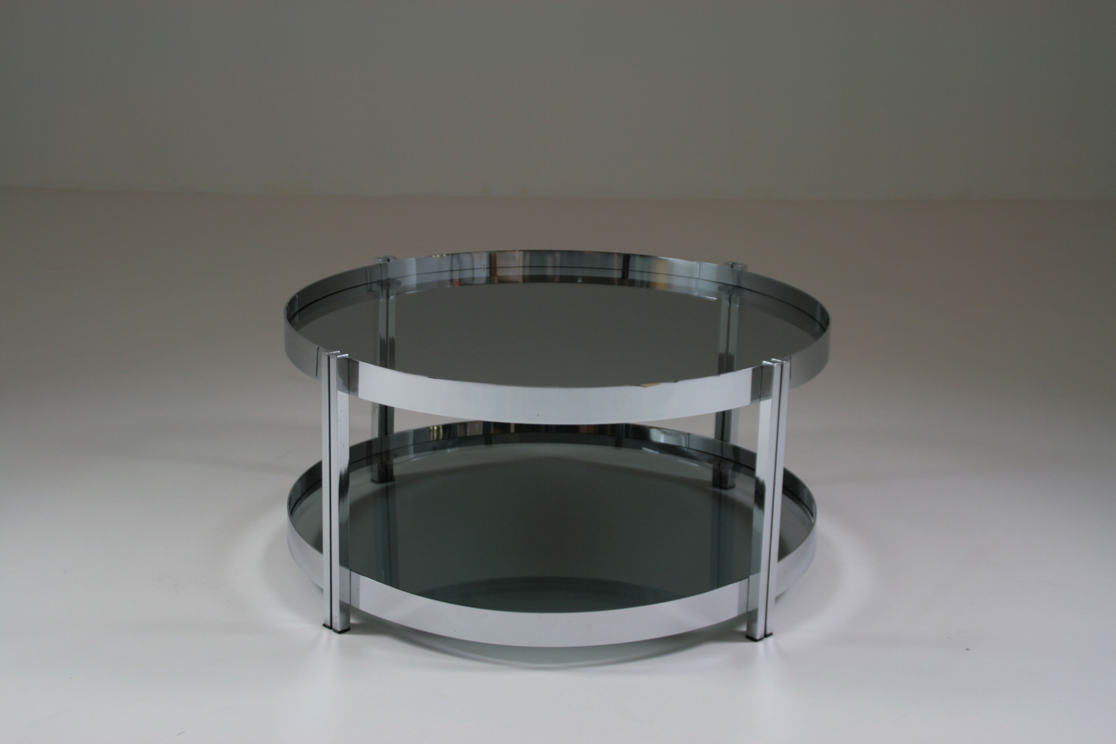 Round chrome-plated metal coffee table and smoked glass tops, France 1970s
