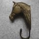 antique brass coat hook with horse head, vintage decor.