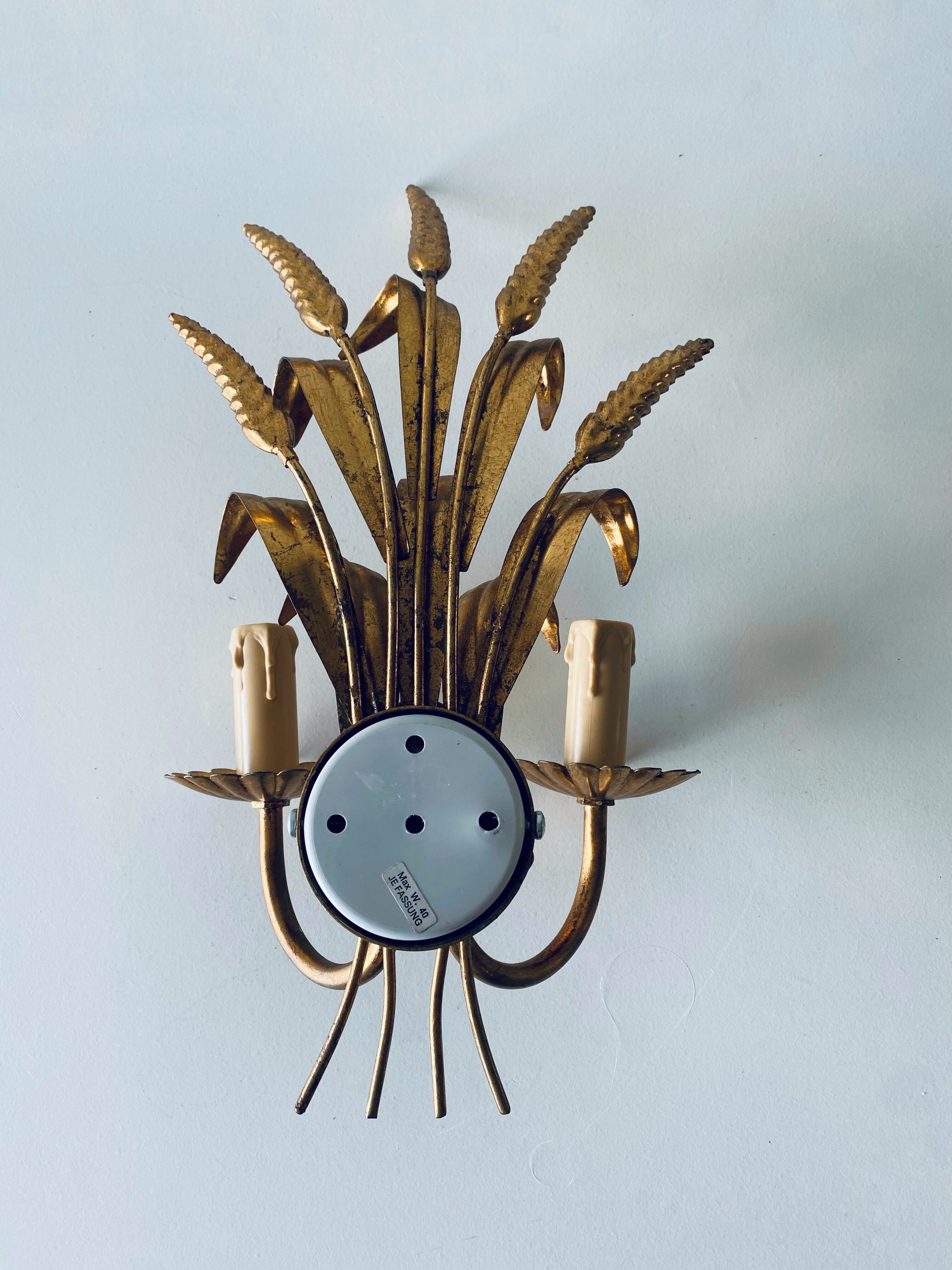 Double golden spike wall lamp