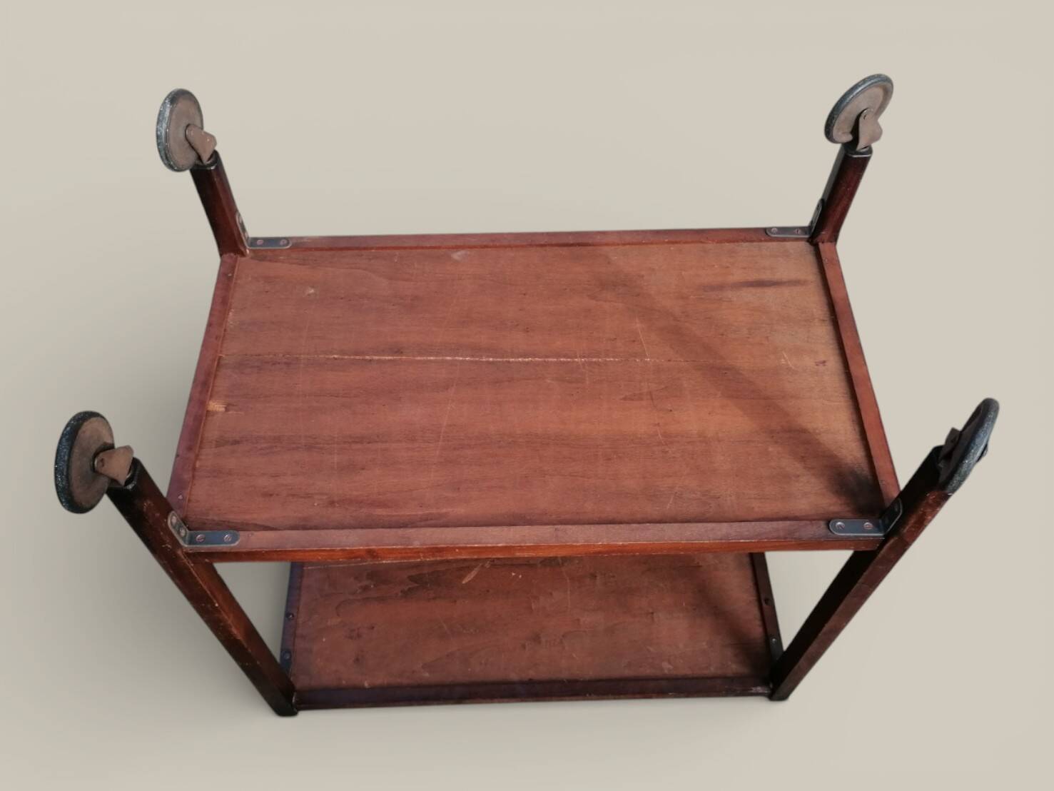 Art Deco wooden serving trolley on wheels.