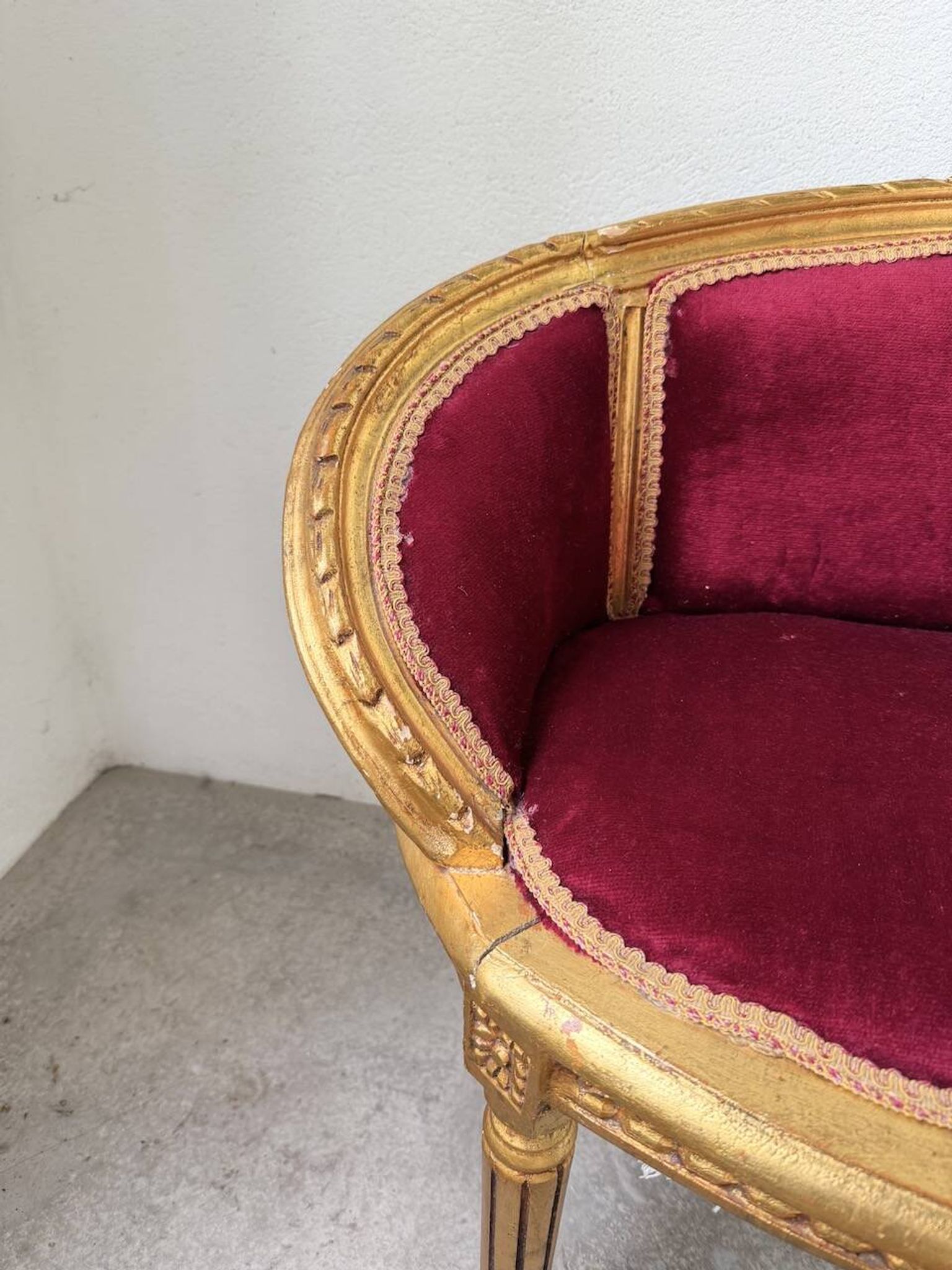 Louis XVI gilt wood and red velvet armchair