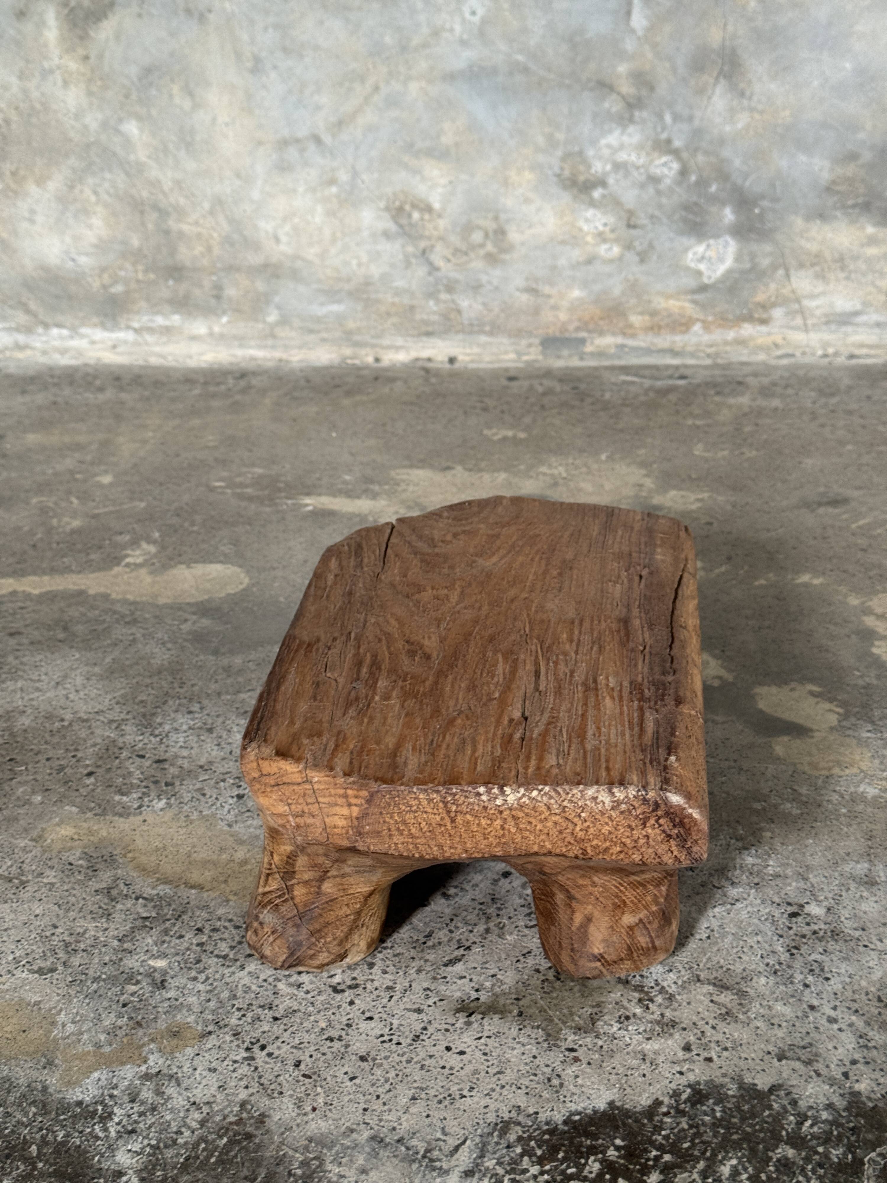Small stool, teak footrest with short cut corners.