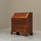Antique English oak secretary with drop-down front.