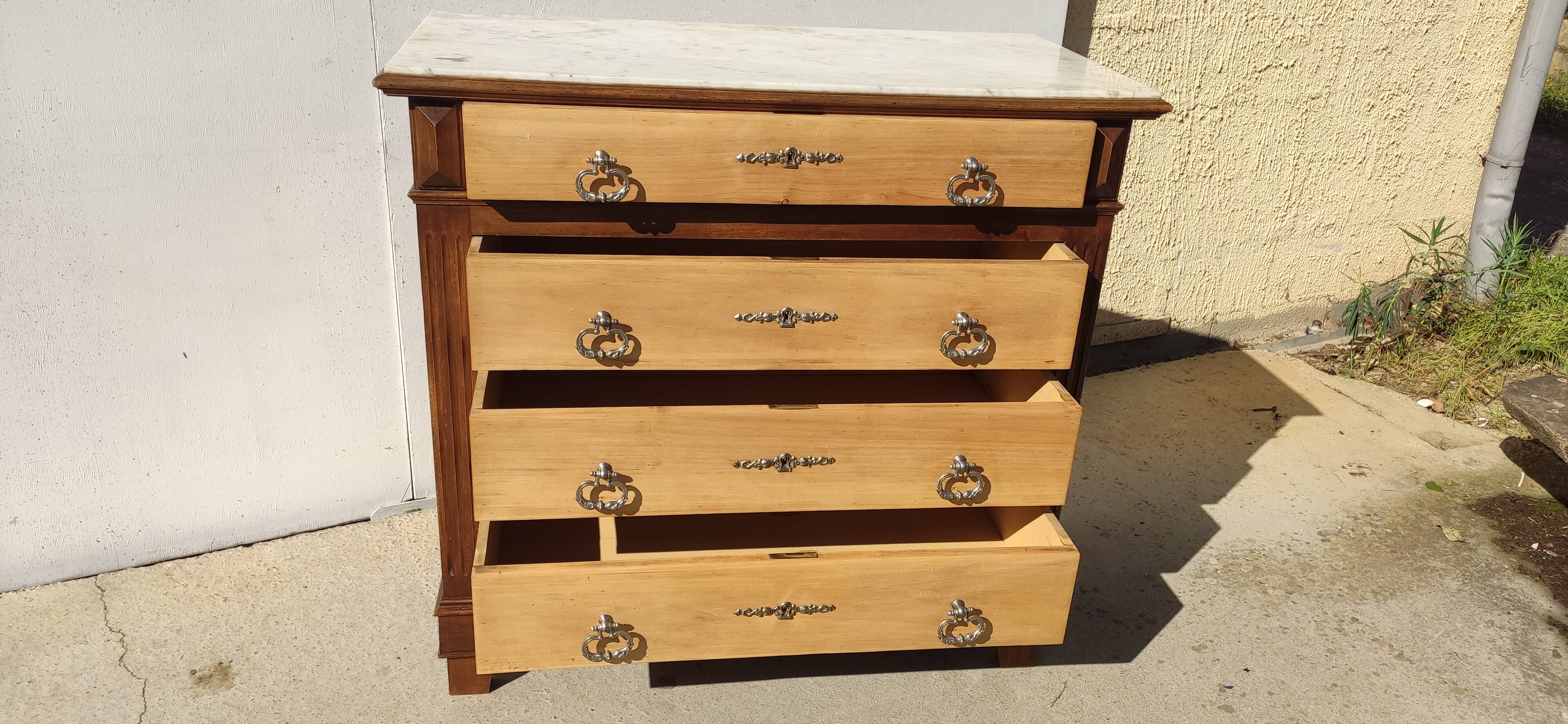 Antique chest of drawers, white marble top.