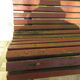 Public bench in wooden slats and cast iron legs