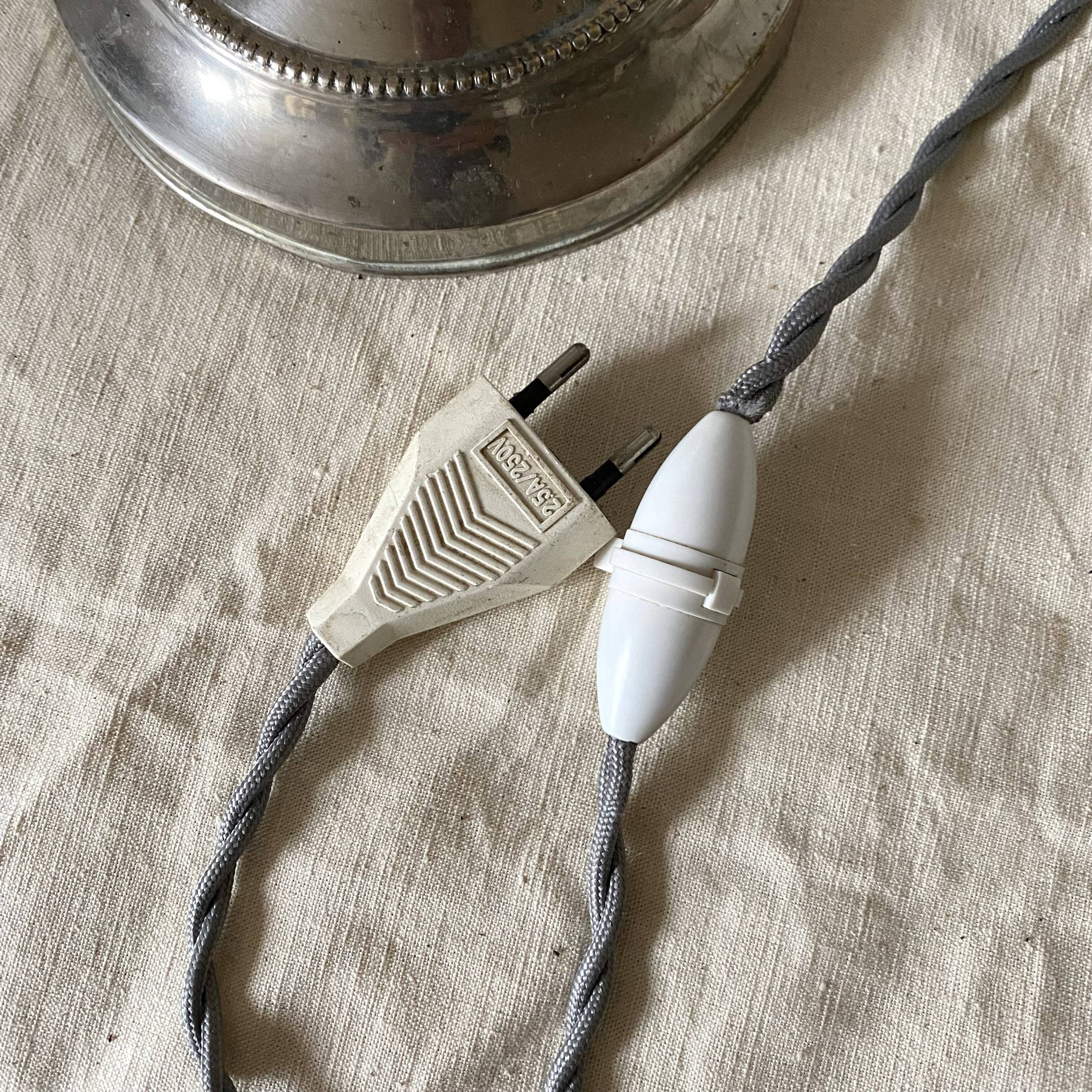 Antique jeweller's lamp, silver-plated base, frosted pink glass shade.