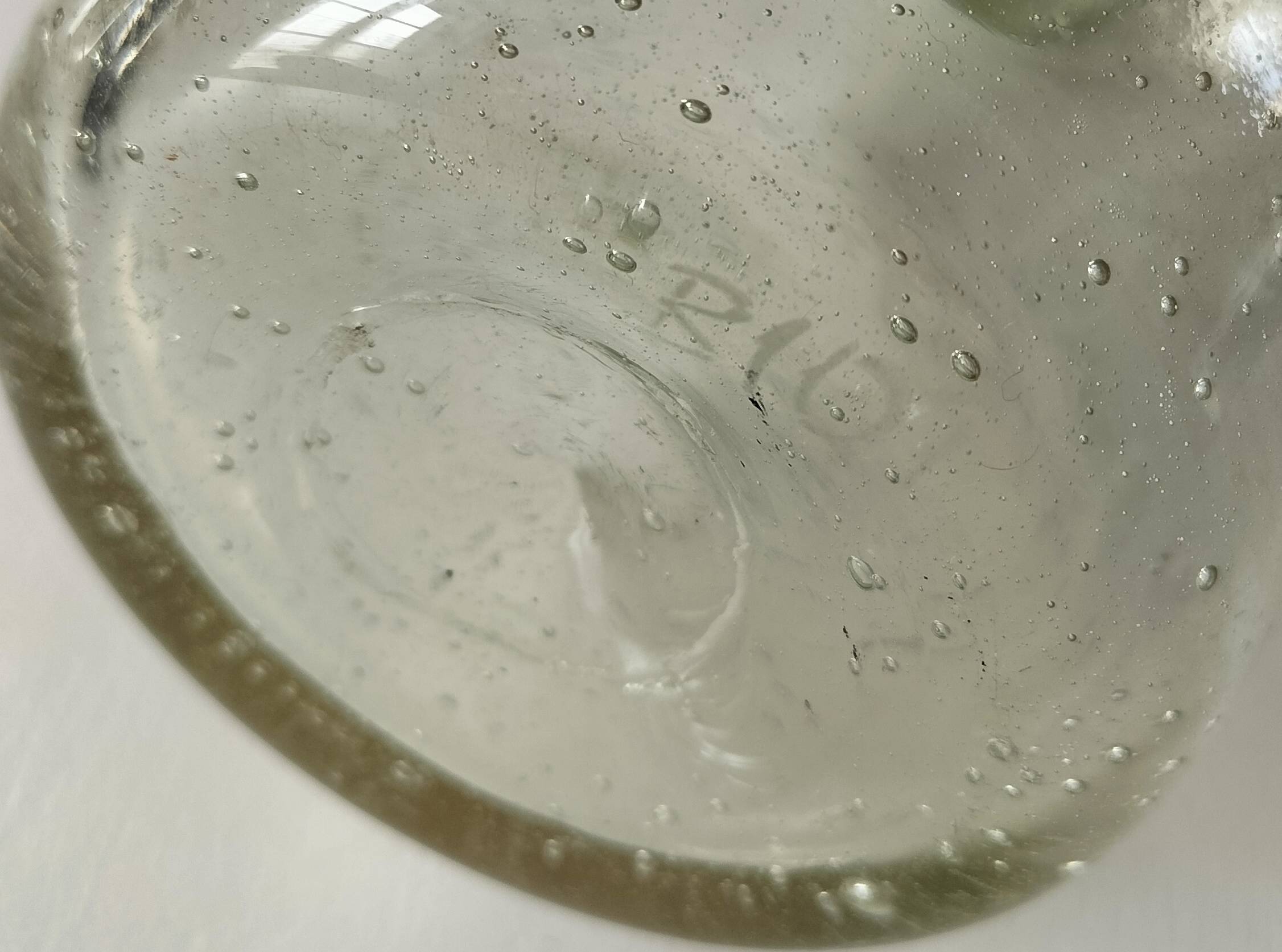 Bubble glass carafe bottle signed Biot in lime green colour.