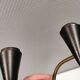 A set of wall lamps in black lacquered metal with brass details
