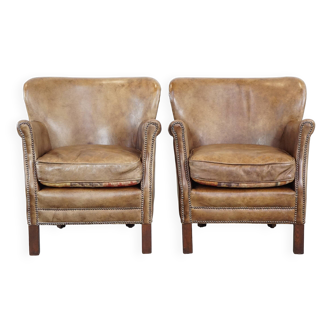 2 fauteuils en cuir de vache