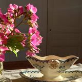 Old gravy boat on frame in terre de fer earthenware by gien, “chardons” model in blue-green